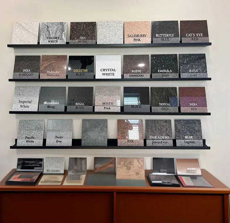 photo of 4 shelves of Granite Colors & Sample Tiles above a credenza