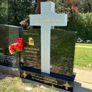 photo of upright headstone black marble grave marker with porcelain photo inlays and cross at Lone Tree Cemetery in Hayward, California