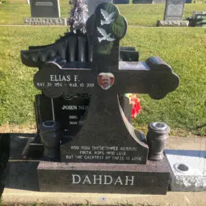 Photo of Upright Cross Gravestone Marker with porcelain photo inlay at Lone Tree Cemetery in Hayward, California with cemetery and monument vases