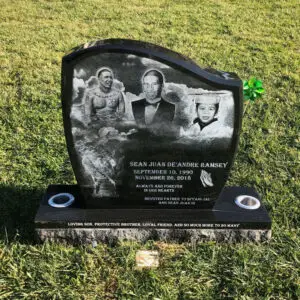 photo of upright headstone black marble grave marker with edgings and edged images at Lone Tree Cemetery in Hayward, California