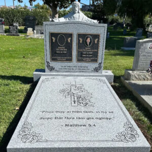 photo of a gray granite flat ledger memorial for two people.