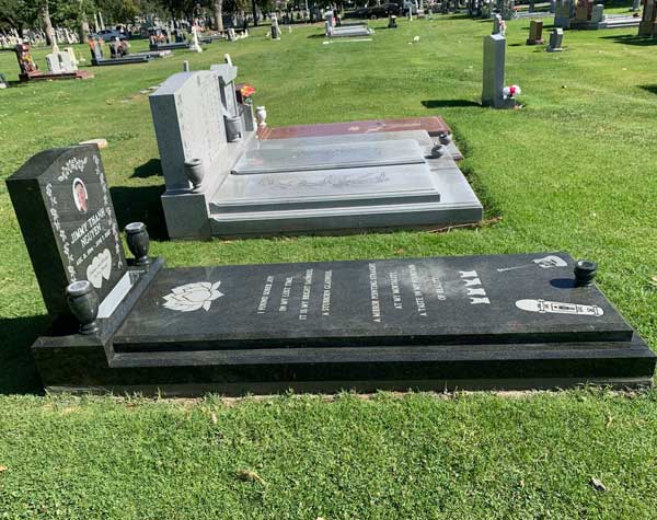 Flat ledger with upright grave marker for Jimmy Than Nguyen at Oak Hill Memorial Park