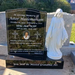 photo of custom dark marble upright headstone with porcelain photo inlay and mary statue at Lone Tree Cemetery in Hayward, California