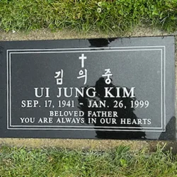 photo of a flat grave marker at Skylawn Cemetery in San Mateo, California