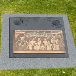 photo of a flat grave marker with bronze plaque at Skylawn Cemetery in San Mateo, California